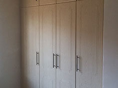 Beech wood grain built in cupboards 